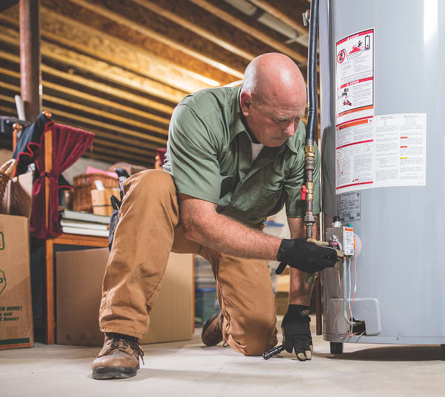 Man fixing propane tank